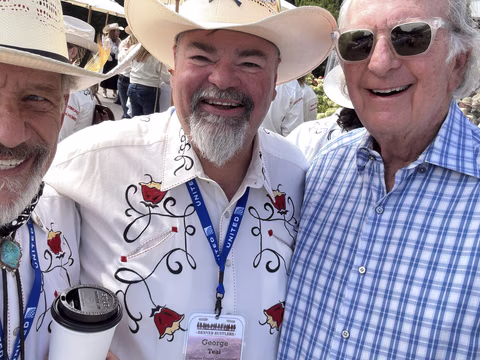 Doug Tisdale with community supporters at an outdoor event