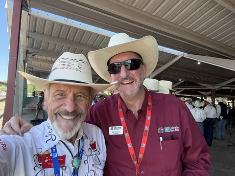 Doug Tisdale with community supporters at an outdoor event